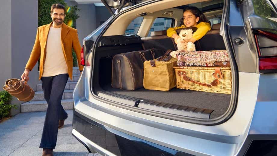 Open boot view of a BMW iX1 loaded for a road trip