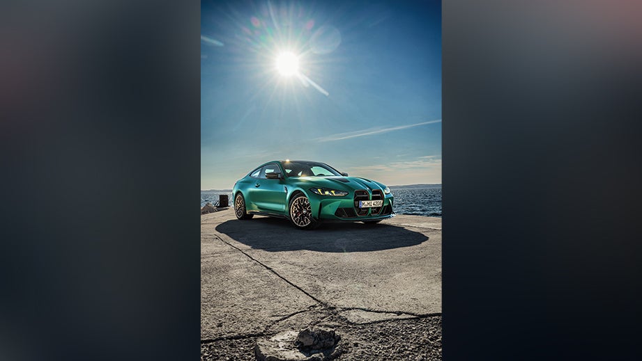 front three-quarter view of a BMW M4 Competition