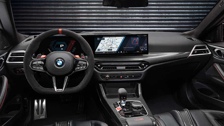 Interior dashboard of a Black Sapphire BMW M4 Competition