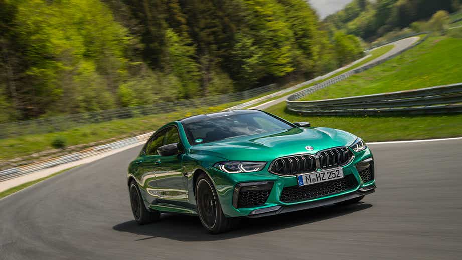 front three-quarter view of a BMW M8 Coupe Competition on a racetrack