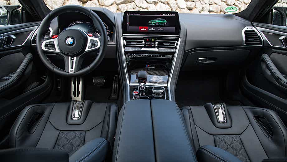 Interior dashboard view of a Black Sapphire BMW M8 Coupe Competition
