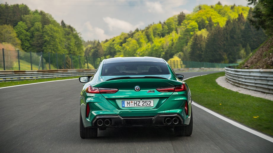 rear view of a BMW M8 Coupe Competition on a racetrack