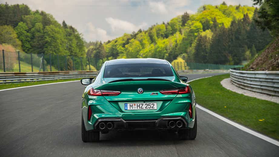 rear view of a BMW M8 Coupe Competition on a racetrack