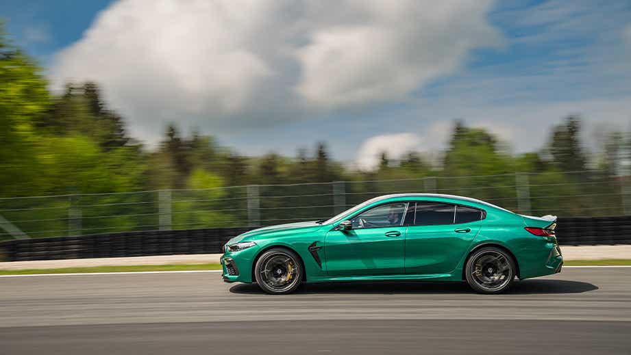 side view of a BMW M8 Coupe Competition driving on a track