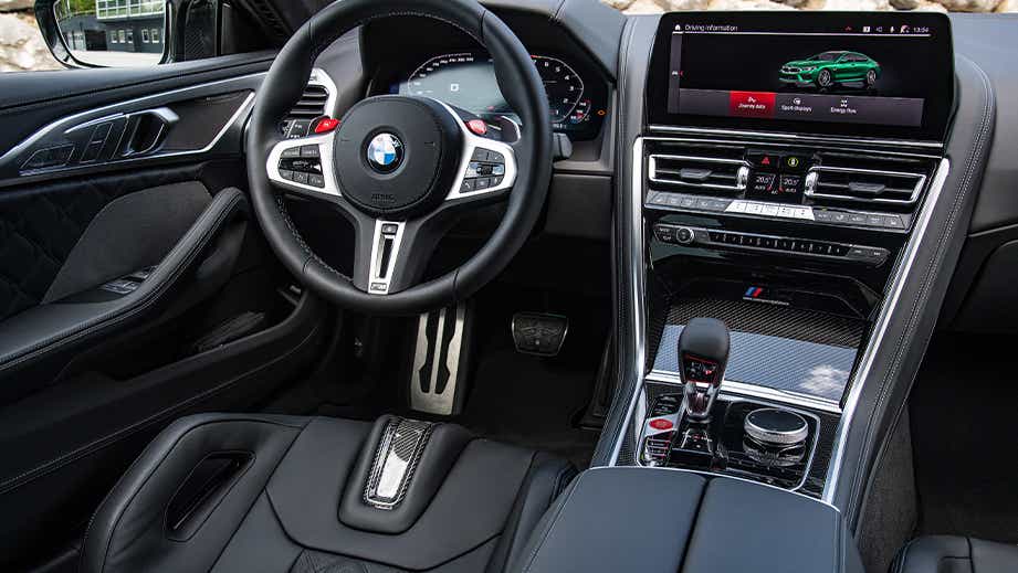 Interior dashboard view of a Black Sapphire BMW M8 Coupe Competition