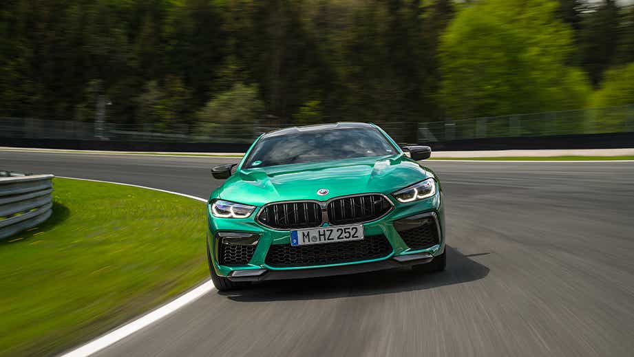 front view of a BMW M8 Coupe Competition on a curved road