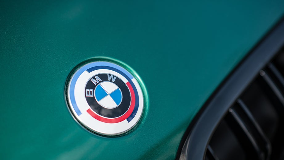 Close-up of BMW M8 Coupe Competition badge on bonnet