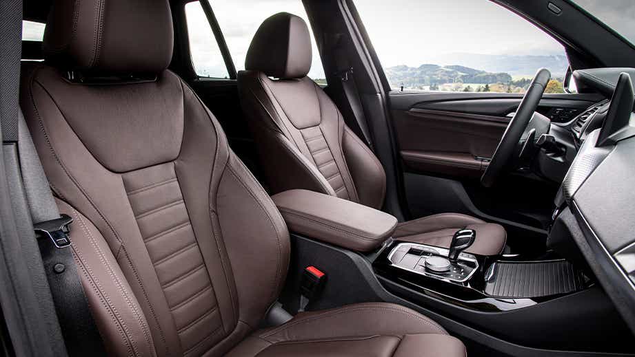 front seat and dashboard view of a BMW X3 2023-2024