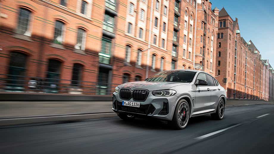 Front three-quarter view of a BMW x4 on city street