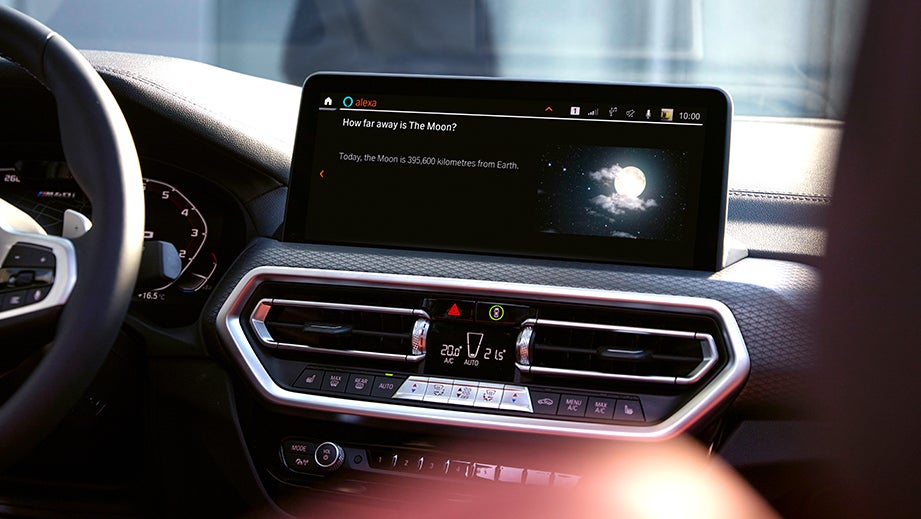 Interior dashboard display of a BMW x4 featuring infotainment screen