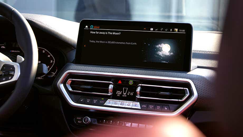 Interior dashboard display of a BMW x4 featuring infotainment screen