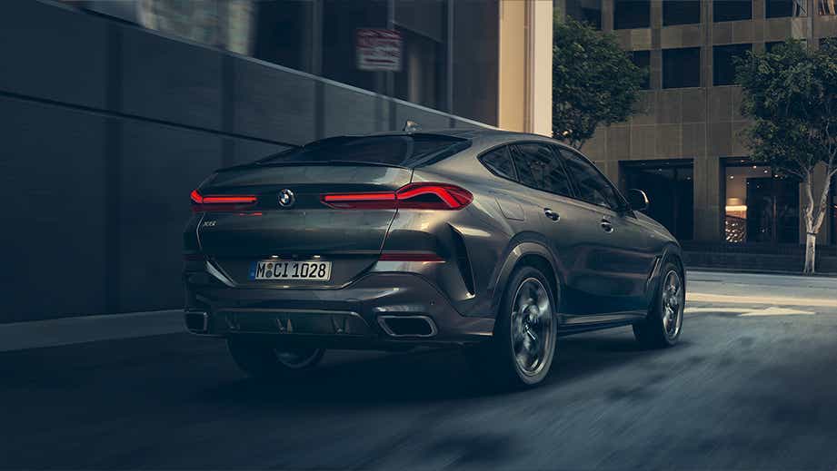 rear three-quarter of a Tanzanite Blue Metallic BMW X6