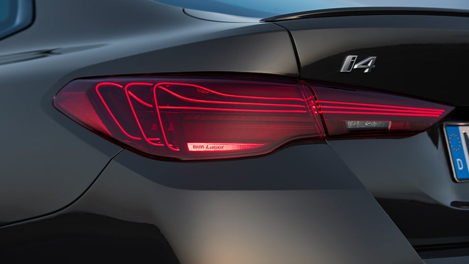 rear taillight and badge of a Black Sapphire BMW i4