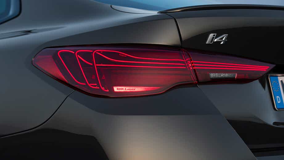 rear taillight and badge of a Black Sapphire BMW i4