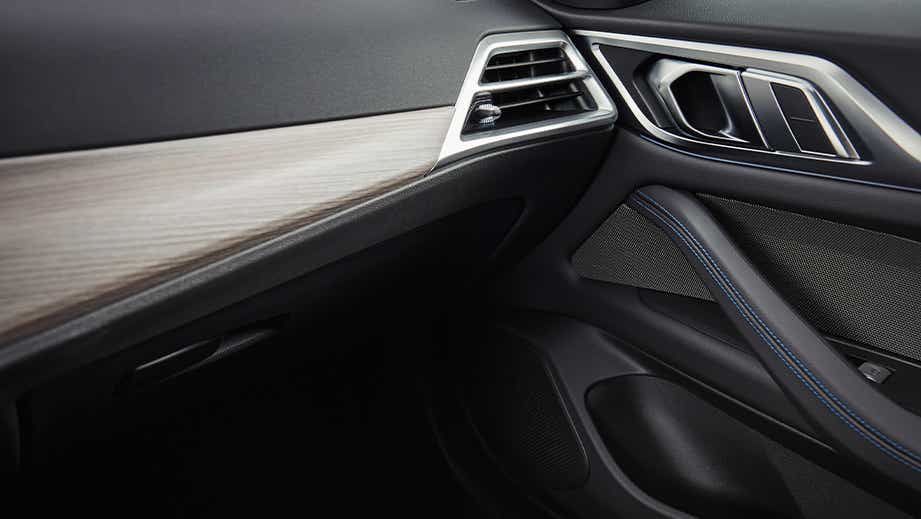 Front passenger interior dashboard and door of a BMW i4