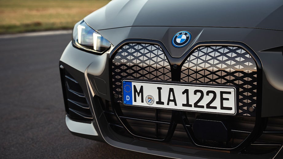 Front grille and headlight close-up of a Black Sapphire BMW i4