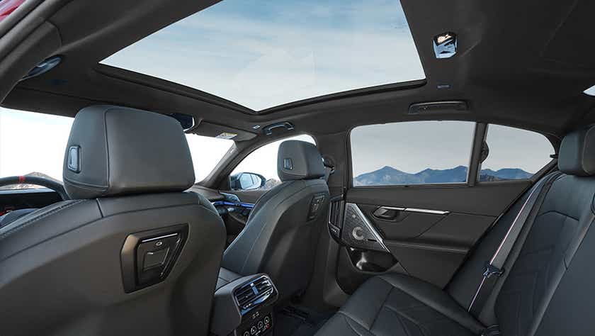 interior rear seat and panoramic sunroof of a BMW i5