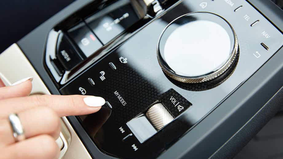 Close-up of the center console controls of a BMW iX