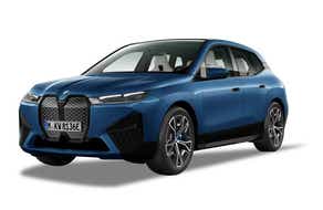 front three-quarter view of a Phytonic Blue Metallic BMW iX