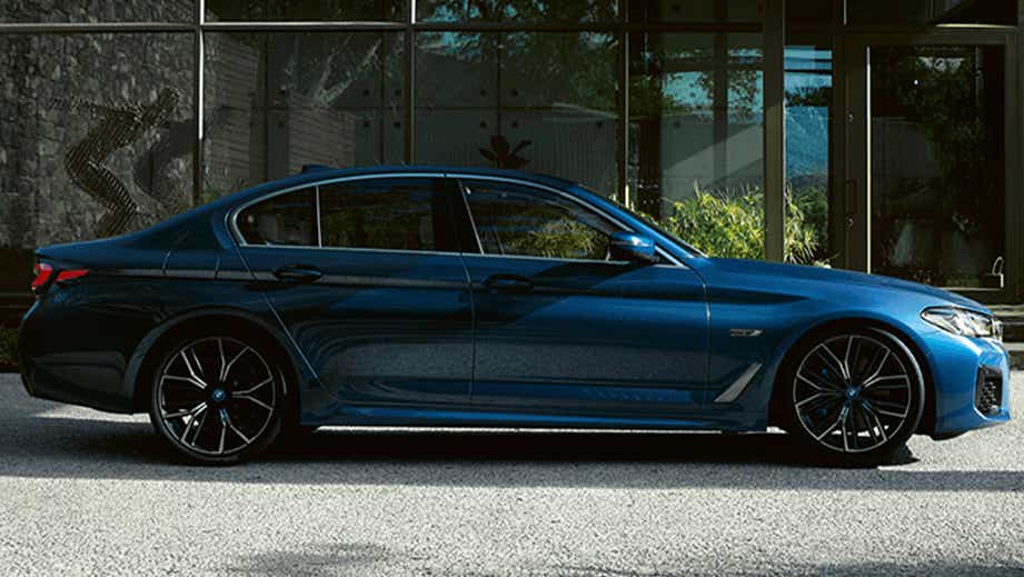 side view of a Phytonic Blue BMW 5 Series 2021-2023