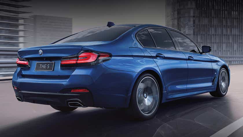 rear three-quarter of a Phytonic Blue BMW 5 Series 2021-2023