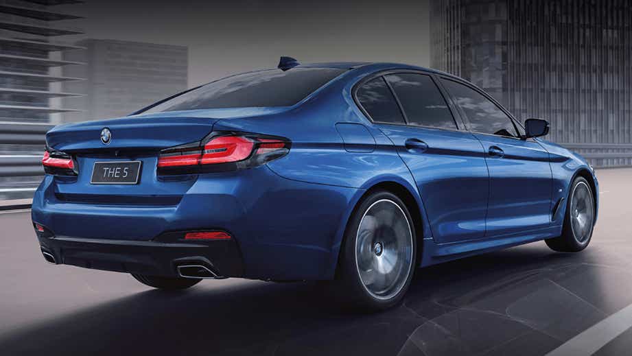rear three-quarter of a Phytonic Blue BMW 5 Series 2021-2023