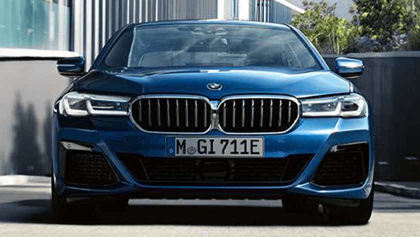 front view of a Phytonic Blue BMW 5 Series 2021-2023