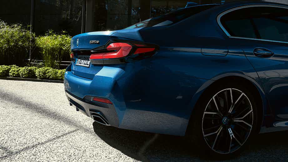 rear three-quarter of a Phytonic Blue BMW 5 Series 2021-2023
