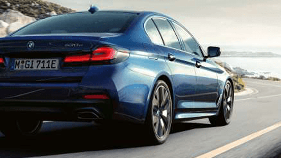 rear three-quarter of a Phytonic Blue BMW 5 Series 2021-2023