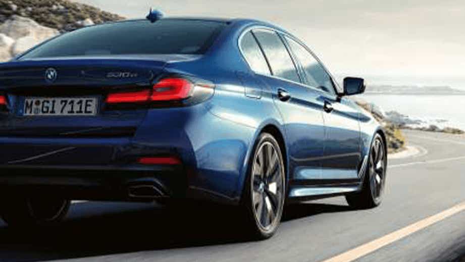 rear three-quarter of a Phytonic Blue BMW 5 Series 2021-2023