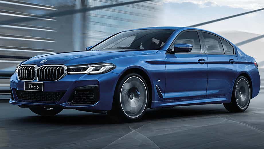 Front three-quarter view of a Phytonic Blue BMW 5 Series 2021-2023