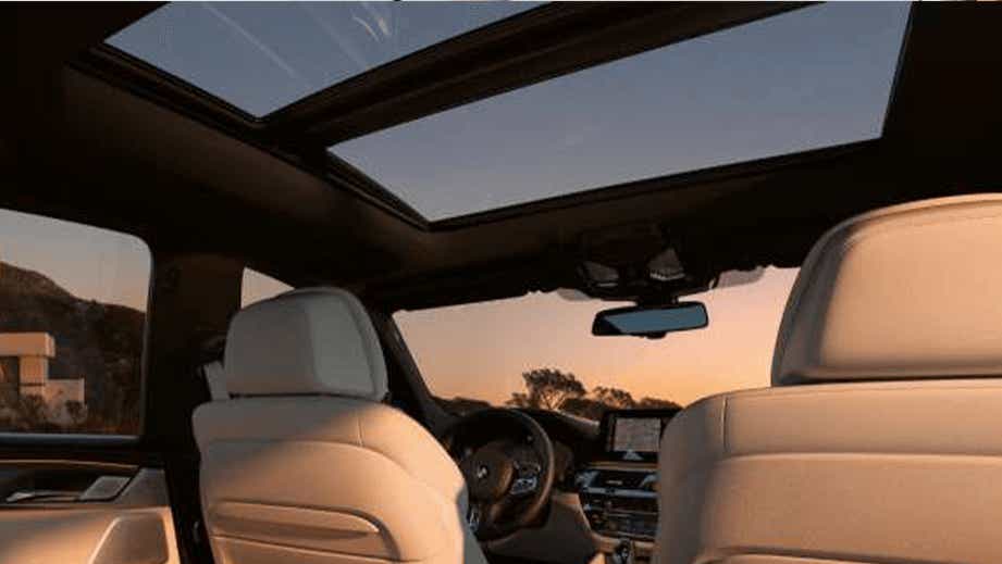 interior dashboard and sunroof view of a BMW 6 Series