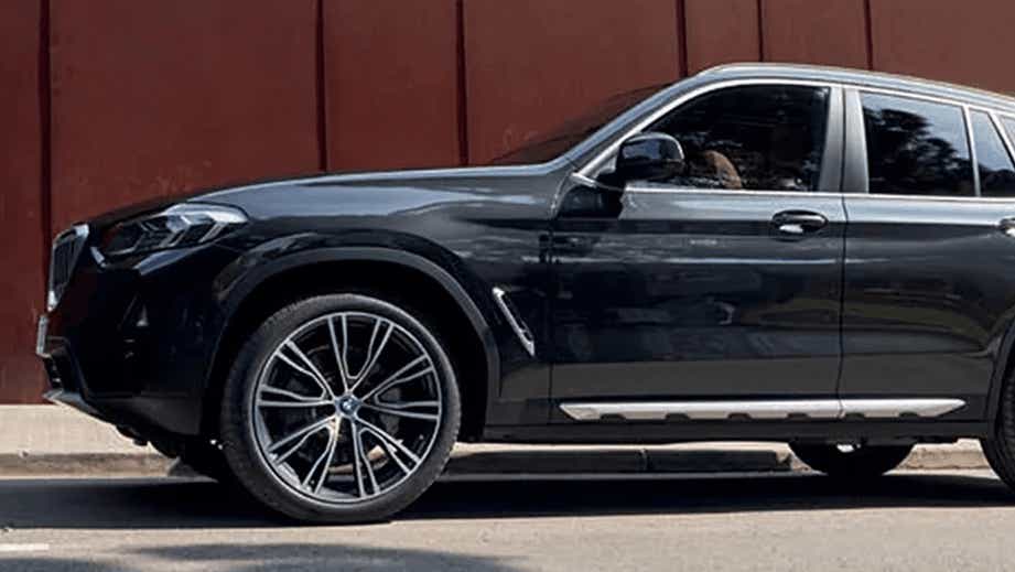 side view of a Black Sapphire BMW X3 2023-2024