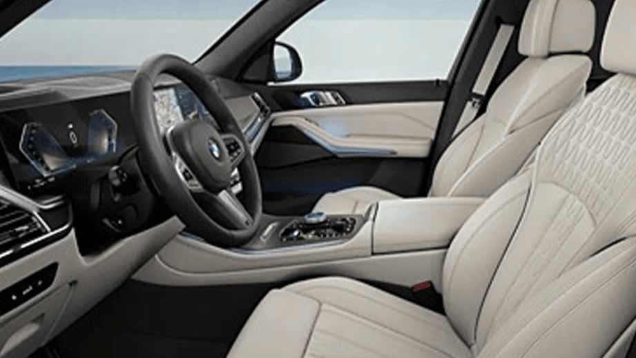 interior front seats and dashboard of a BMW X5