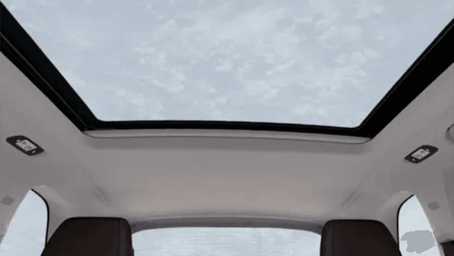 Panoramic sunroof view of a BMW X5 interior