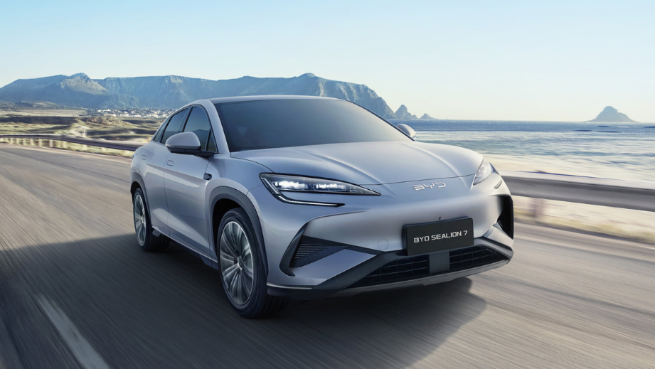 Front three-quarter view of a BYD Sealion 7 driving on a coastal road