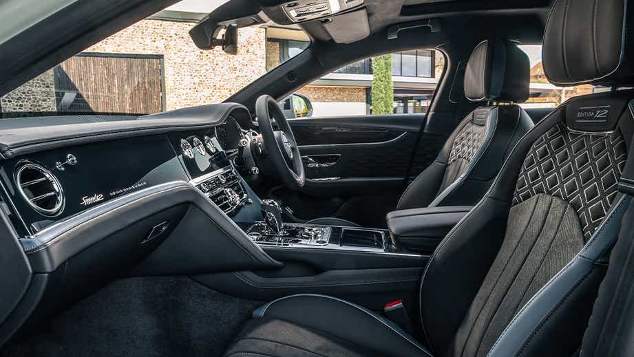 interior dashboard and front seats of a Bentley Flying Spur