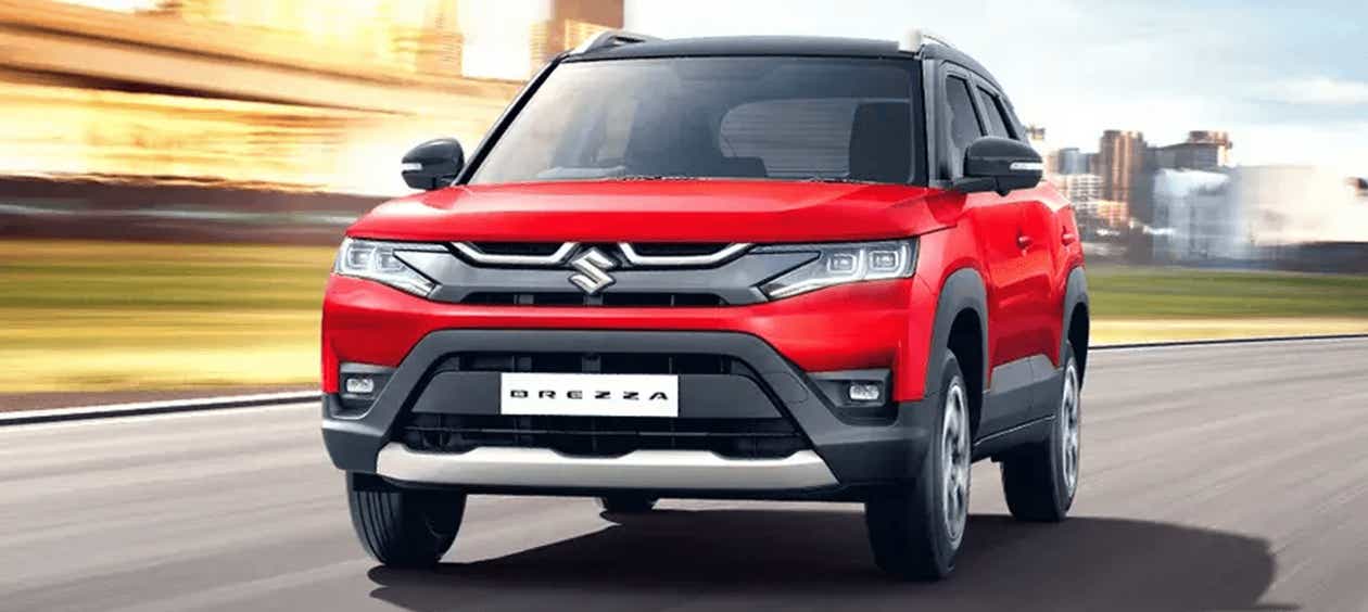 front view of a Sizziling Red With Midnight Black Maruti Suzuki Brezza