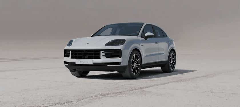 front three-quarter view of a White Porsche Cayenne Coupe