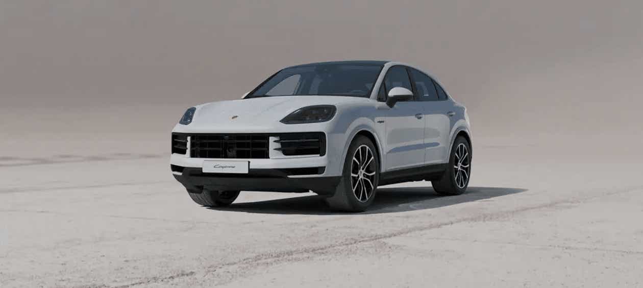 front three-quarter view of a White Porsche Cayenne Coupe