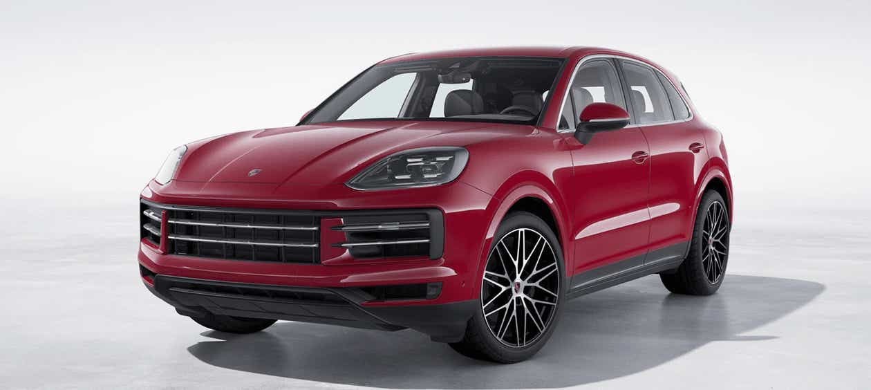 front three-quarter view of a Carmine Red Porsche Cayenne