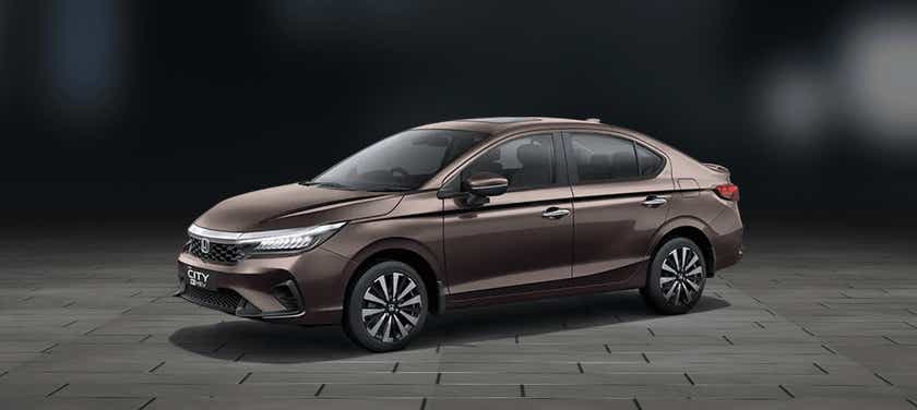 front three-quarter view of a Meteoroid Grey Metallic Honda City Hybrid