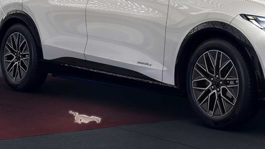 Side view of a Ford Mach-E showing wheels and door area