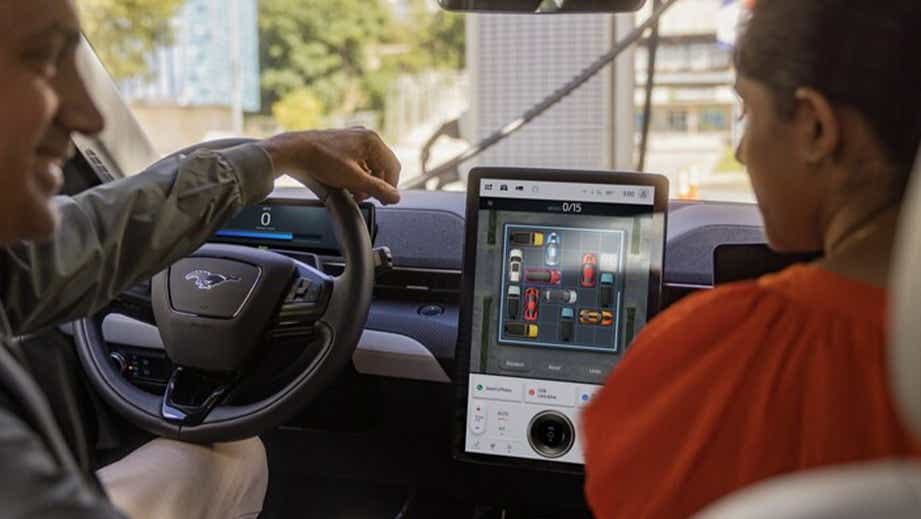 Interior dashboard view of a Ford Mach-E showing the infotainment touchscreen