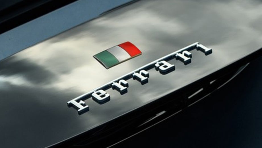 Bonnet close-up with emblem of a Ferrari 812