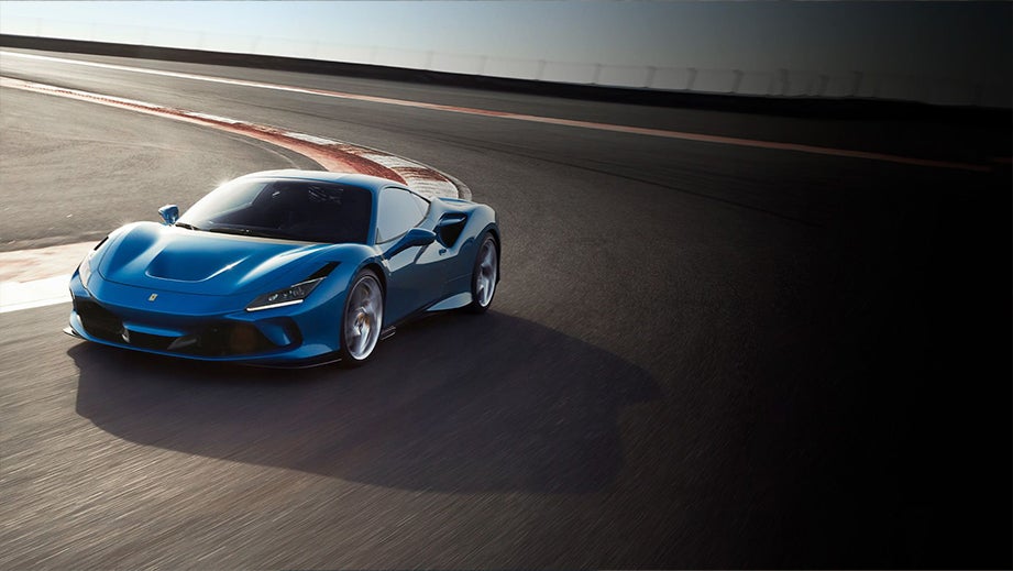front three-quarter view of a Ferrari F8 Tributo on a race track