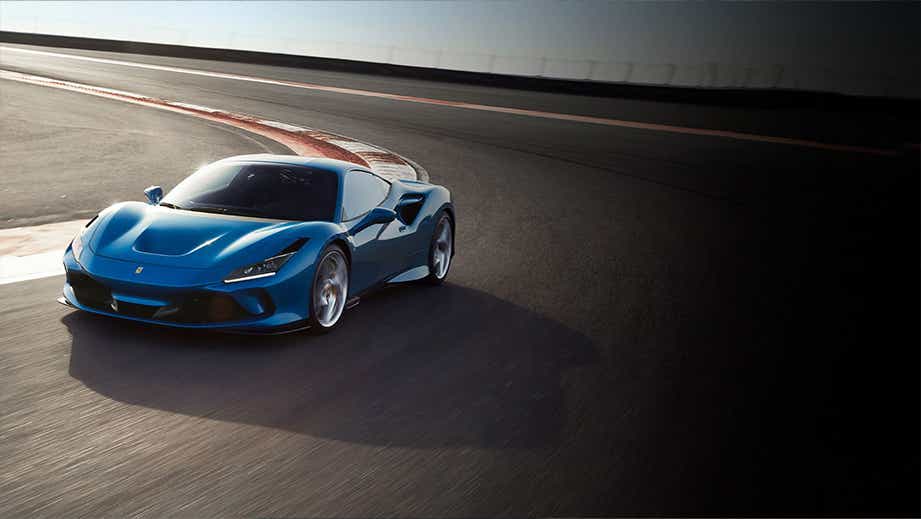 front three-quarter view of a Ferrari F8 Tributo on a race track