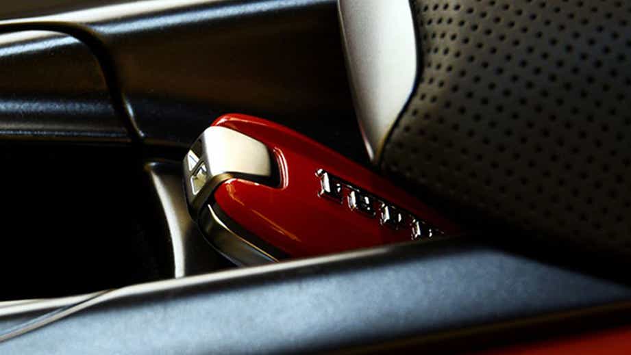 Close-up of car key fob in a Ferrari F8 Tributo interior