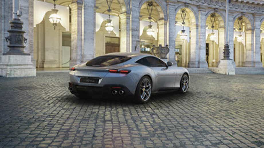 rear three-quarter view of a Argento Nurburg Ring Ferrari Roma