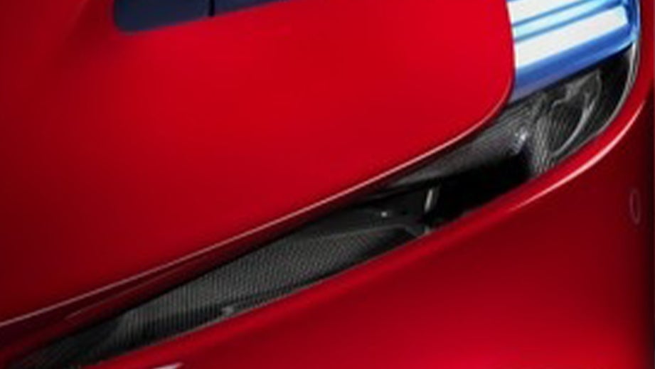 Headlight close-up of a Rosso Corsa Ferrari SF90 Stradale